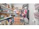 Organized walk-in closet features custom shelving, ample storage, and hanging space for clothing and accessories at 2242 E 12Th Ave, Apache Junction, AZ 85119