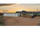Exterior view of home with desert landscaping and scenic mountain backdrop at sunset at 2242 E 12Th Ave, Apache Junction, AZ 85119
