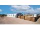 Exterior view of home with desert landscaping, wooden fence and playset at 2242 E 12Th Ave, Apache Junction, AZ 85119