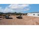 Expansive lot showcasing a trailer and jeep with convenient outbuildings for storage at 2242 E 12Th Ave, Apache Junction, AZ 85119
