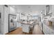 A stunning kitchen featuring white cabinets, stainless steel appliances, and a large center island with seating at 2242 E 12Th Ave, Apache Junction, AZ 85119