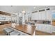 Open kitchen with stainless steel appliances, white cabinets, and large center island with bar seating at 2242 E 12Th Ave, Apache Junction, AZ 85119