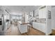 A modern kitchen with white cabinets, stainless steel appliances, and a spacious layout at 2242 E 12Th Ave, Apache Junction, AZ 85119