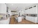 Open concept kitchen featuring white cabinets and a large island with seating at 2242 E 12Th Ave, Apache Junction, AZ 85119