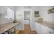 Functional laundry room with modern appliances and plenty of counter space at 2242 E 12Th Ave, Apache Junction, AZ 85119