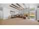 Inviting living room with beamed ceilings, plush furniture, and seamless outdoor access at 2242 E 12Th Ave, Apache Junction, AZ 85119