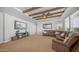 Comfortable living room with wood-beamed ceiling and plush sectional sofa at 2242 E 12Th Ave, Apache Junction, AZ 85119