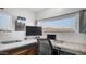 Bright home office features dual monitors, modern desk space, with outside mountain view at 2242 E 12Th Ave, Apache Junction, AZ 85119