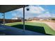 The patio is covered and has a view of the backyard and mountains at 2242 E 12Th Ave, Apache Junction, AZ 85119