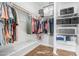 Organized walk-in closet featuring ample shelving and hanging space, ideal for efficient storage solutions at 2242 E 12Th Ave, Apache Junction, AZ 85119
