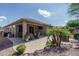 Charming backyard patio with a covered area, mature landscaping, and a cozy seating area at 22574 W Moonlight Path, Buckeye, AZ 85326