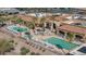 Aerial view of community pool with lounge chairs and well-kept landscaping at 22574 W Moonlight Path, Buckeye, AZ 85326
