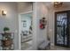 Beautiful entryway with a view to the living room, designer front door, and neutral decor at 22574 W Moonlight Path, Buckeye, AZ 85326
