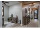 Inviting entryway with tile floors and modern wood furniture and decor at 22574 W Moonlight Path, Buckeye, AZ 85326