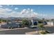 Stunning Southwestern-style building with mountain views, landscaping and a spacious parking lot at 22574 W Moonlight Path, Buckeye, AZ 85326