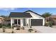 Charming single-story home featuring a modern farmhouse design with a two-car garage and inviting landscaping at 23433 W Burton Ave, Buckeye, AZ 85326