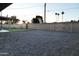 Expansive backyard with gravel, block fence, and some landscaping at 236 E Minton Dr, Tempe, AZ 85282