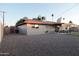 The back of the house features a large yard, covered patio, and mature landscaping at 236 E Minton Dr, Tempe, AZ 85282