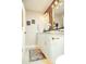 Bright bathroom with white cabinets, gold hardware, stylish mirrors and updated lighting at 236 E Minton Dr, Tempe, AZ 85282