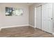 Bedroom with hardwood floors, ceiling fan and sliding closet doors at 236 E Minton Dr, Tempe, AZ 85282