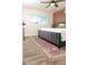 Cozy bedroom with a grey bed, wooden floors, and natural light from a window at 236 E Minton Dr, Tempe, AZ 85282