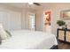 Bright bedroom with a ceiling fan, closet, ensuite bathroom and a comfortable bed at 236 E Minton Dr, Tempe, AZ 85282
