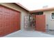 Charming home featuring a distinctive red brick entry, painted garage door, and stylish front gate at 236 E Minton Dr, Tempe, AZ 85282