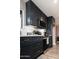Well-lit kitchen showcases stainless appliances, dark cabinets, light countertops, and a modern design at 236 E Minton Dr, Tempe, AZ 85282