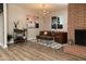 Cozy sitting area with brick fireplace, stylish furniture, and contemporary lighting fixtures at 236 E Minton Dr, Tempe, AZ 85282