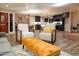 Open-concept living area featuring modern furnishings, sleek black kitchen, and warm wood flooring at 236 E Minton Dr, Tempe, AZ 85282