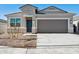 Charming single-Gathering home featuring a two-car garage and well-maintained gravel landscaping at 25464 W Fraktur Rd, Buckeye, AZ 85326