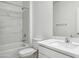 Modern bathroom with a combined shower and tub, white marble wall, and a sleek vanity at 25471 W Fraktur Rd, Buckeye, AZ 85326