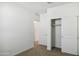 Bright bedroom with plush carpet and closet with sliding doors at 25471 W Fraktur Rd, Buckeye, AZ 85326