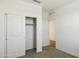 Bright bedroom with plush carpet and closet with sliding doors at 25471 W Fraktur Rd, Buckeye, AZ 85326