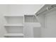 Spacious walk-in closet featuring multiple shelves and a rod for ample storage at 25471 W Fraktur Rd, Buckeye, AZ 85326