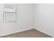 Cozy bedroom with natural light through window blinds and neutral carpet at 25477 W Fraktur Rd, Buckeye, AZ 85326