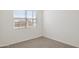 Comfortable bedroom featuring a window with blinds and neutral colored carpet at 25477 W Fraktur Rd, Buckeye, AZ 85326