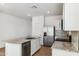 Well-equipped kitchen boasting stainless steel appliances, granite counters, and ample cabinet space at 25477 W Fraktur Rd, Buckeye, AZ 85326