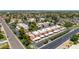 Expansive aerial view of a residential community with a swimming pool and well maintained desert landscaping at 26 E Coral Gables Dr, Phoenix, AZ 85022