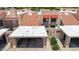 Property aerial view featuring covered parking, tile roof, and red awnings highlighting curb appeal at 26 E Coral Gables Dr, Phoenix, AZ 85022