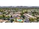 High aerial view showcasing the community's well-maintained landscaping and community pool and spa at 26 E Coral Gables Dr, Phoenix, AZ 85022