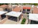 Aerial view highlighting covered parking, red awnings, tile roofs, and landscaped courtyard at 26 E Coral Gables Dr, Phoenix, AZ 85022