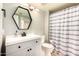 Bathroom vanity with modern sink, lighting, and fixtures at 26 E Coral Gables Dr, Phoenix, AZ 85022