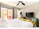 Bright bedroom with sliding glass door to outside patio at 26 E Coral Gables Dr, Phoenix, AZ 85022