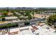 Scenic view of the property and its well-maintained surroundings, enhanced by the backdrop of lush trees and neighborhood at 26 E Coral Gables Dr, Phoenix, AZ 85022