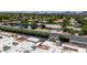 Scenic view of the property and its well-maintained surroundings, enhanced by the backdrop of lush trees and neighborhood at 26 E Coral Gables Dr, Phoenix, AZ 85022
