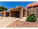 Charming home with a covered carport, desert landscaping, and direct access to the home at 26 E Coral Gables Dr, Phoenix, AZ 85022
