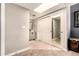 Hallway with closet and doorway to a stylishly renovated bathroom at 26 E Coral Gables Dr, Phoenix, AZ 85022