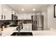 Modern kitchen features sleek countertops, stainless steel appliances, and ample cabinet space at 26 E Coral Gables Dr, Phoenix, AZ 85022