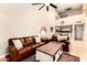 Bright living room with high ceilings offers comfortable seating and a view of the dining area at 26 E Coral Gables Dr, Phoenix, AZ 85022